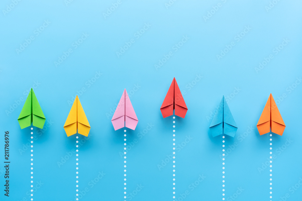 Paper plane on blue background, Business competition concept.
