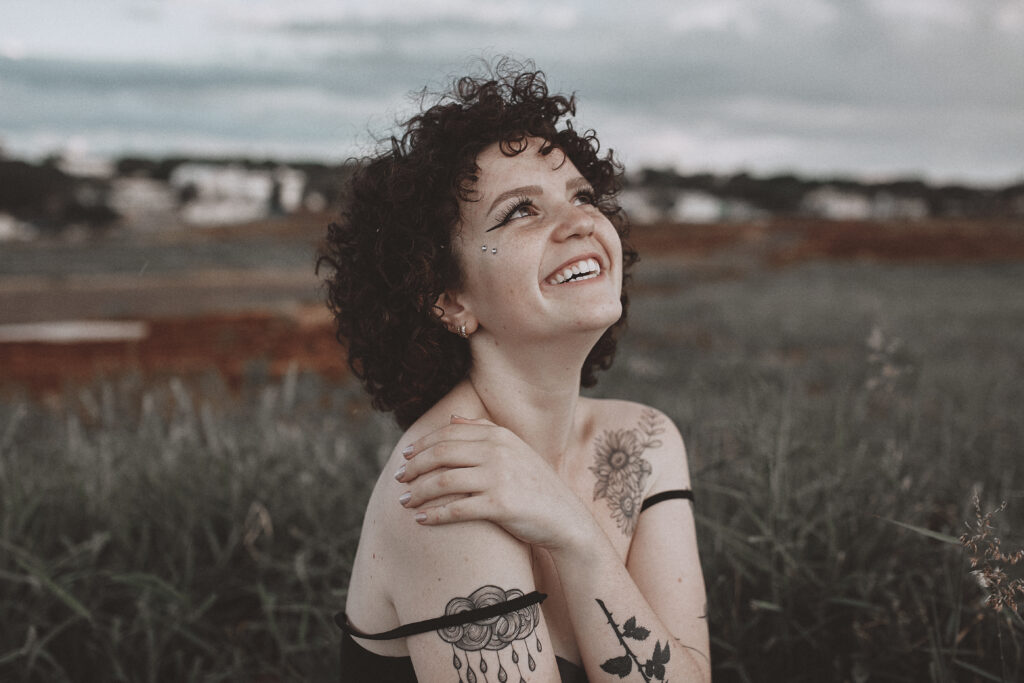 Woman holding her shoulder